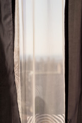 White and gray curtains at the windows