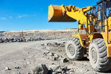 wheel loader excavator at granite or iron ore opencast mine