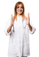 Young doctor woman holding something