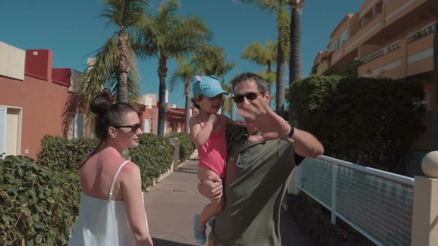 Happy family on their Tenerife holiday, slow motion full hd clip