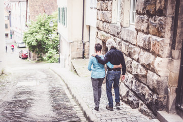 Fototapeta na wymiar Senior Couple Walking Through Tuebingen