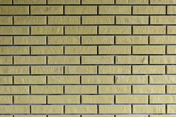 Background. Brick wall of yellow. Brown.
