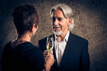 Senior Married Couple Having Champagne For Their Anniversary