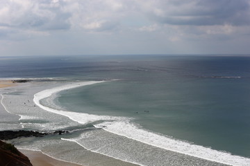 Surfers test their skills near the Great Ocean Road, Melbourne Australia