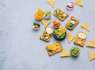 Healthy Eating, Diet sandwiches on gluten-free loaves - with guacamole, fresh vegetables on gray table, copy space