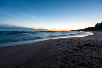 View of a rocky coast beach in the morning.