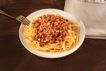 Plate of pasta with meat and tomato sauce