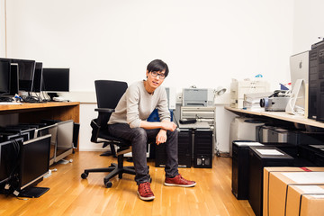 System Administrator With Lots Of Hardware, Computers And Monitors