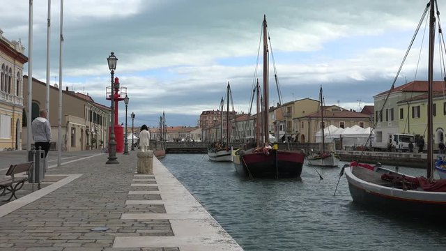 cloudy day on the boats of  port channel in Italy