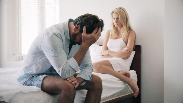 Couple in argument in bed room