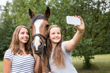 Teenage Girls With Their Pony