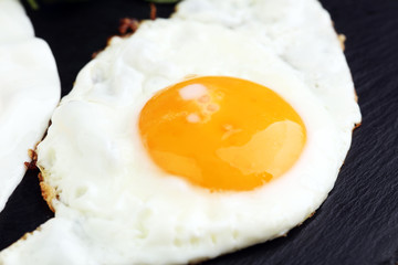 fried eggs with basil pepper and salt