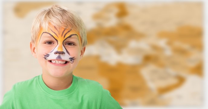 Boy with facepaint against blurry brown map