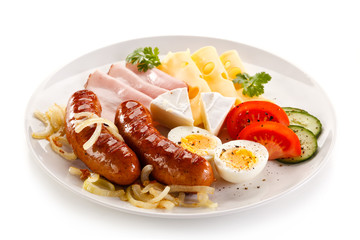 Breakfast with grilled sausages and egg