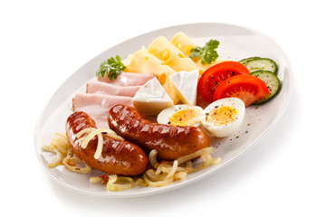 Breakfast with grilled sausages and egg