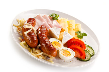 Breakfast with grilled sausages and egg