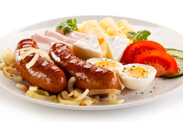 Breakfast with grilled sausages and egg
