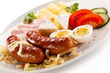 Breakfast with grilled sausages and egg