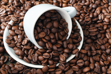 scattering of coffee beans with cup
