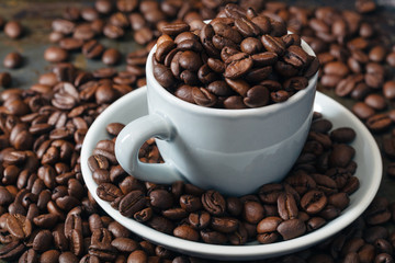 Coffee beans in coffee cup