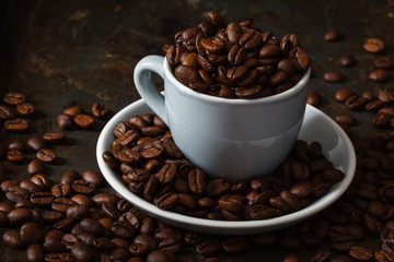 Cup full of coffee beans. Close-up.