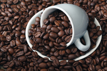 Cup full of coffee beans. Close-up.