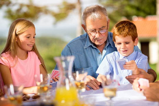 Grandfather Is Playing Cards.