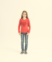 Fototapeta premium Girl teenager with long hair in a red T-shirt