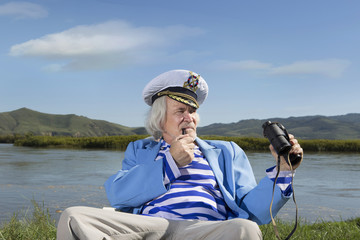 Captain looks through binoculars