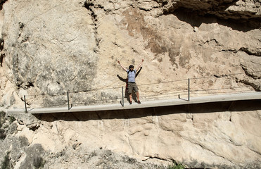 Man traveler hiking along mountain trails. Spain