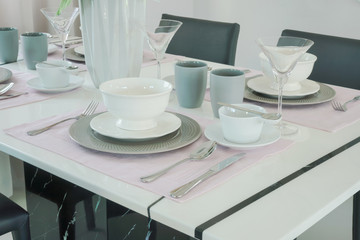 Romantic dining set with beautiful flower vase at the center of dining table