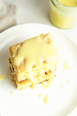 Cupcake and lemon kyrd on a white plate top view.