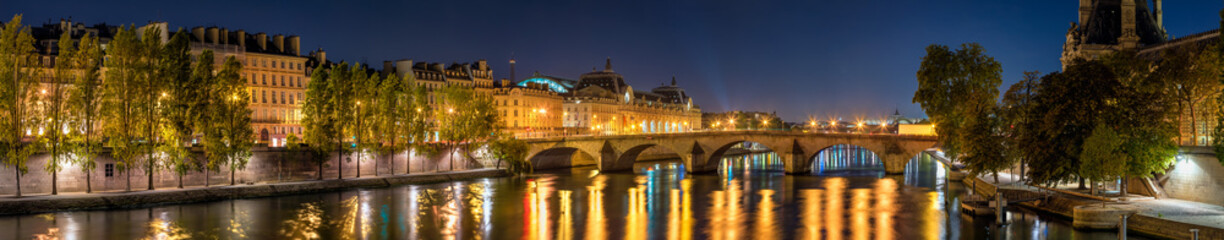 Panoramic view on the Seine River banks, the Pont Royal bridge, and Orsay Museum at dawn. Paris, 7th Arrondissement, France - obrazy, fototapety, plakaty