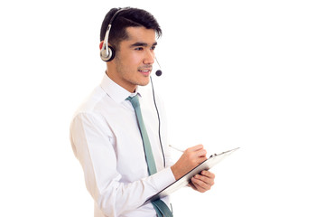 Young man in headphones holding a folder 