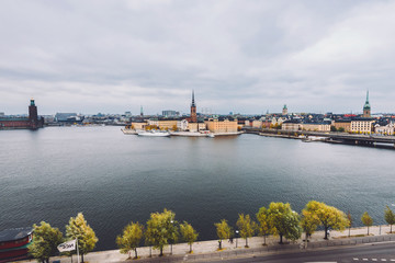 Fototapeta na wymiar Stockholm panorama with Old Town Gamla Stan and Centralbron bridge view from Monteliusvagen in Sodermalm island. Stockholm skyline with City Hall, Riddarholm Church and Old German Church, Sweden.