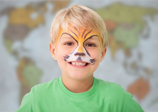Boy with facepaint against blurry map