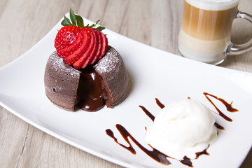 Chocolate fondant lava cake with strawberries and ice cream