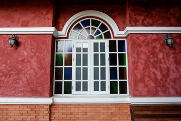 classic style window on red brick wall