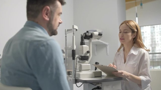 Male patient at ophthalmologist on consultation
