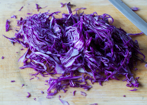 shredded red cabbage on cutting plate