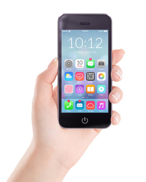 Black mobile smartphone with homescreen colorful application icons on the screen in female hand