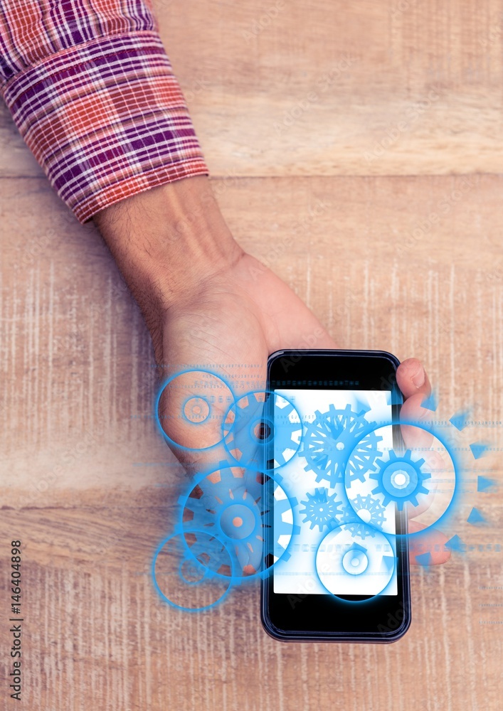 Poster overhead of hand with phone showing blue cog graphics with flare