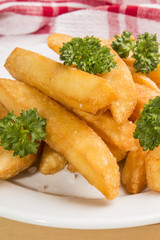 french fries with parley on a plate
