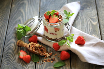 Homemade granola with nuts, strawberry and yogurt