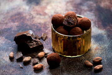 Chocolate candies truffles with chocolate cream close-up