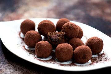 Chocolate candies truffles with chocolate cream close-up
