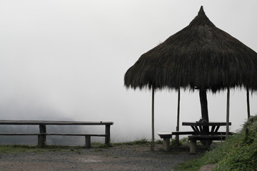 Seat on top of the mountain with fog covered ,silhouette