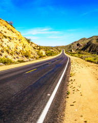 The Bartlett Dam Road as it winds through the semi desert landscape of Tonto National Forest in Arizona, United States