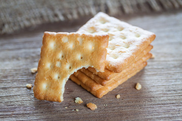 Crackers or biscuit on wooden background