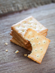 Crackers or biscuit on wooden background
